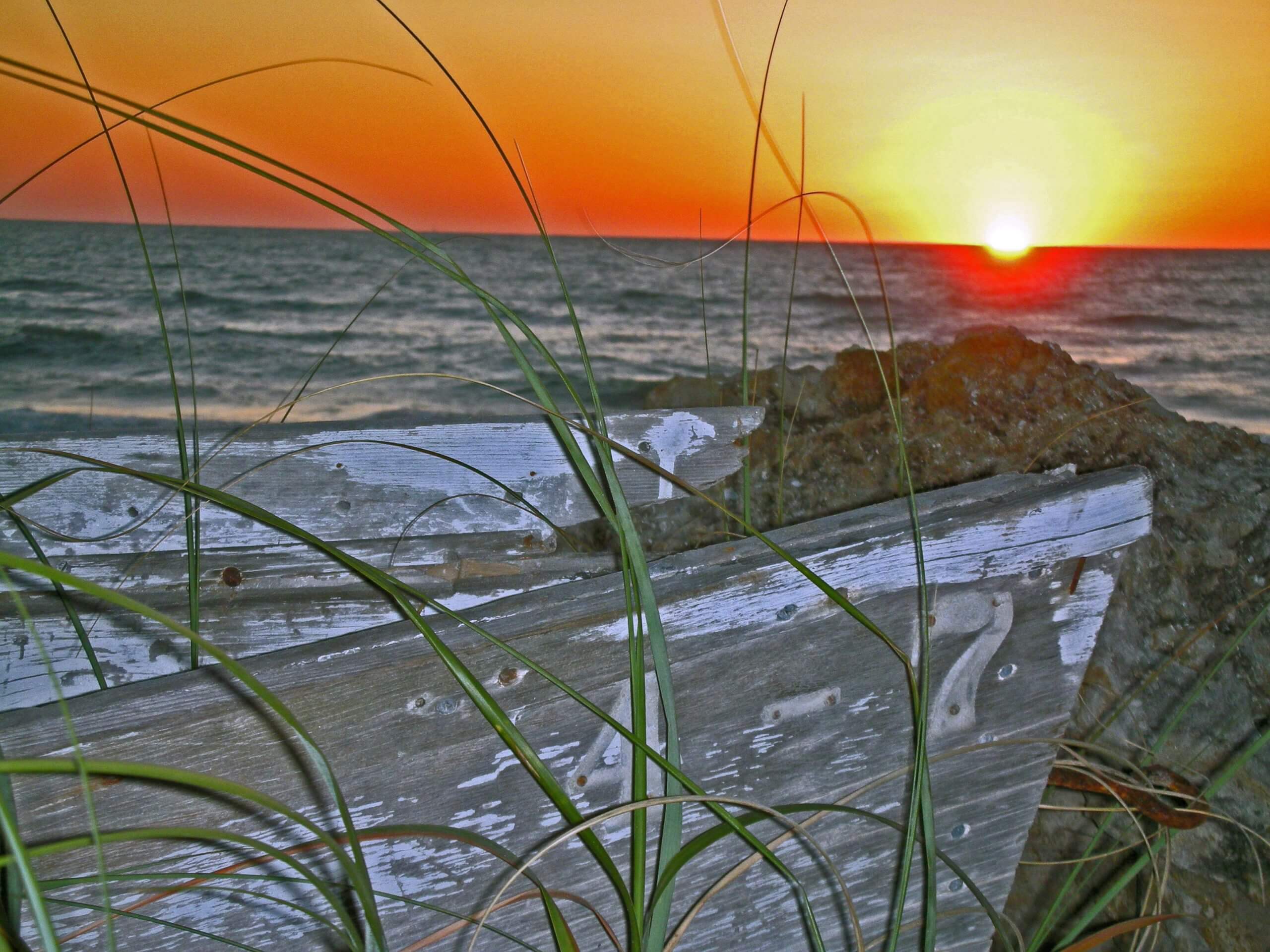 seascape with sunset and boat at Bradenton beach Florida