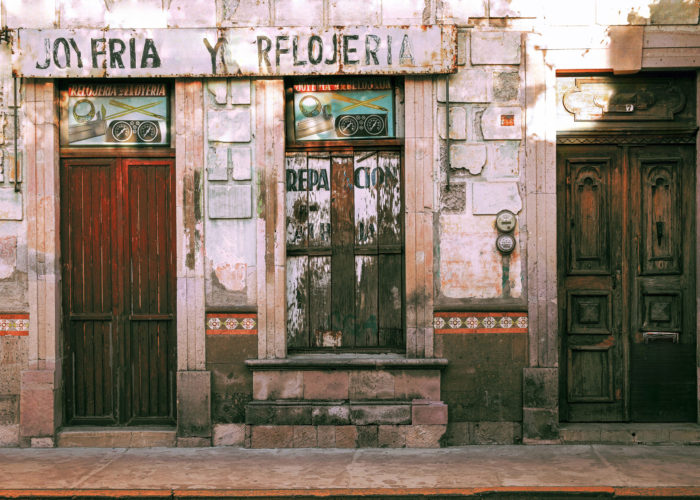 very old jewelry and watch repair shop in Spain and decorative wooden doors